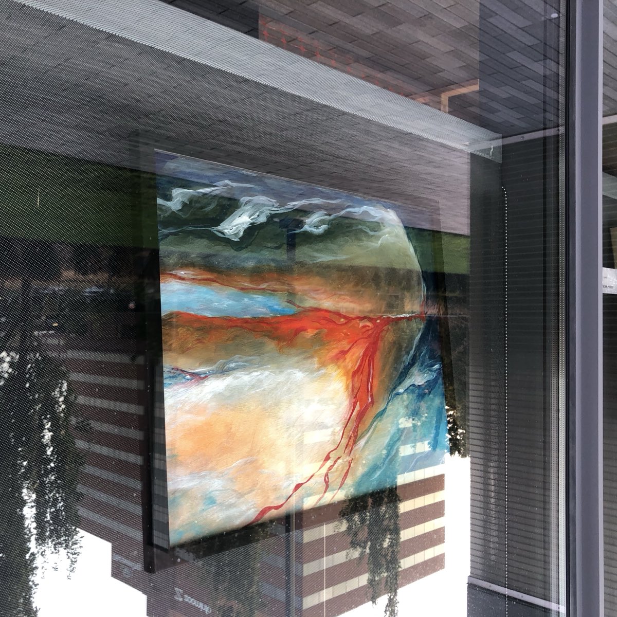 An abstract landscape painting on display